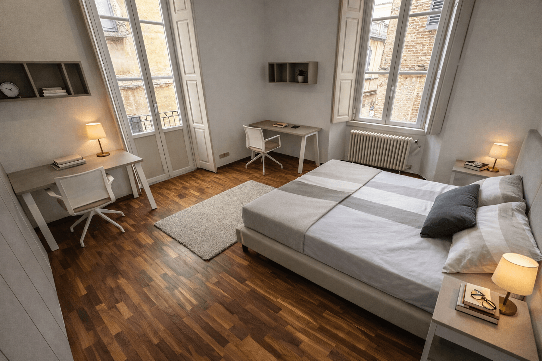 Posto letto in ampia doppia in residence universitario a Pavia centro (via Cardano): ristrutturato, luminoso e silenzioso, con 2 postazioni studio